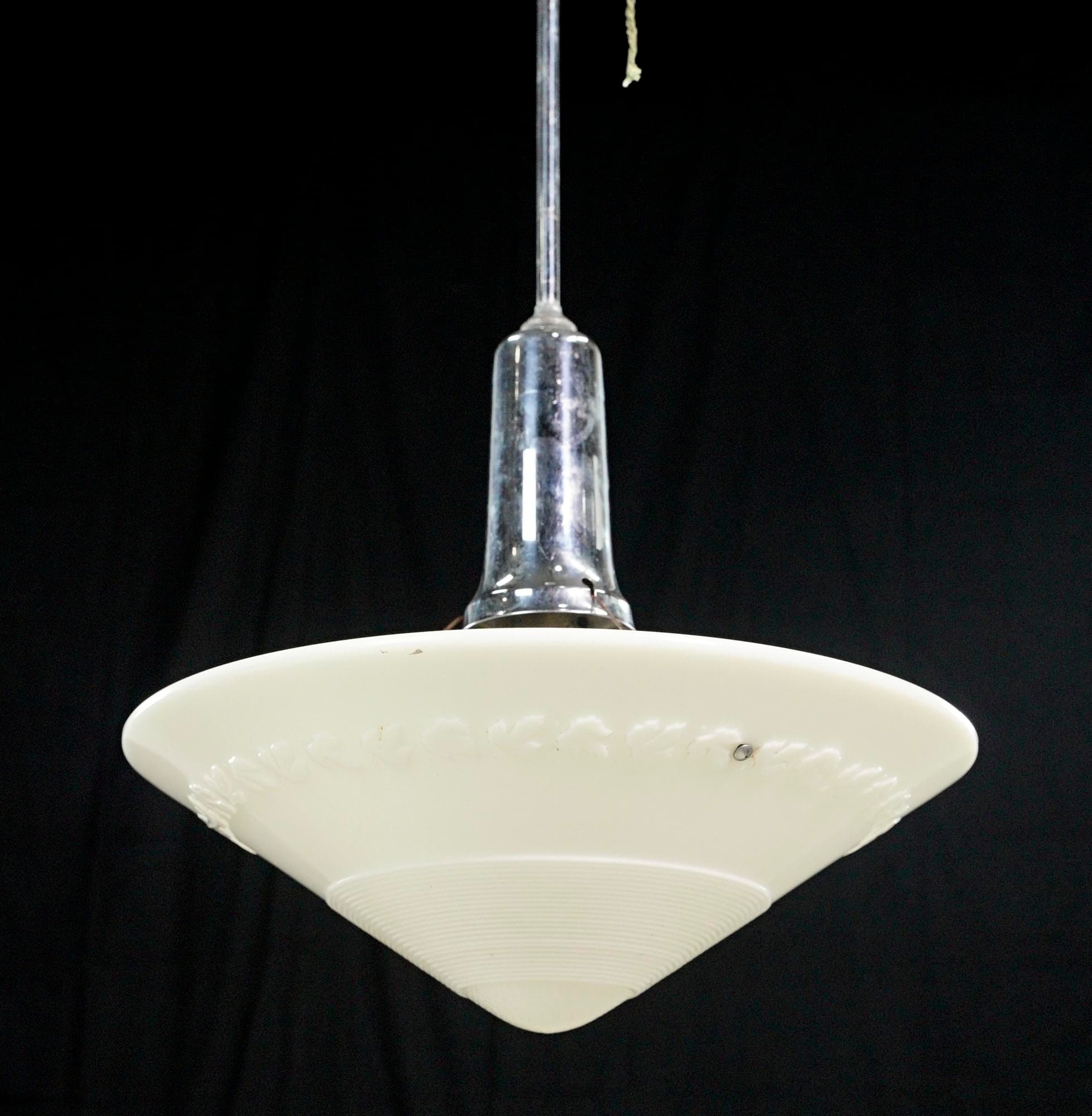 White milk glass pendant light with a pointed saucer-shaped shade and a chrome steel pole.