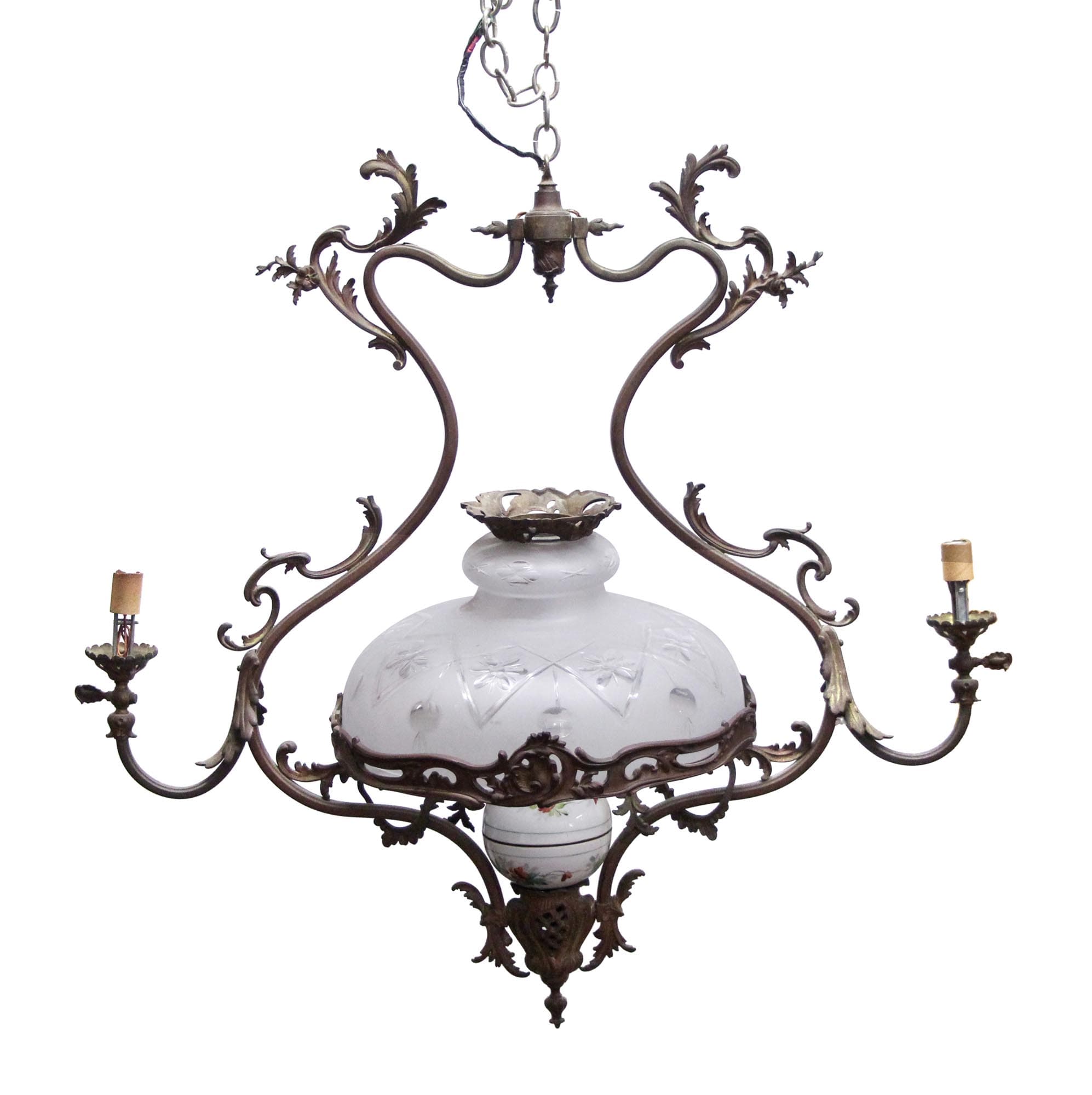 Victorian two-arm bronze gas light with a frosted glass shade, chain hanging above, and two exposed bulb sockets on the sides.